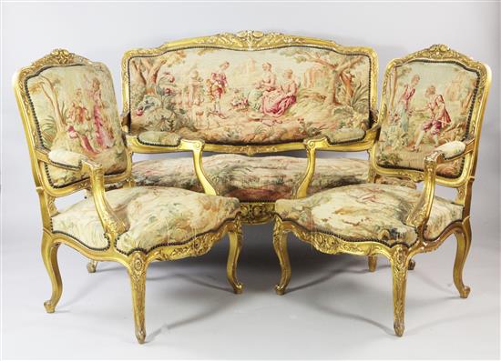 A Louis XV style floral carved three piece suite,